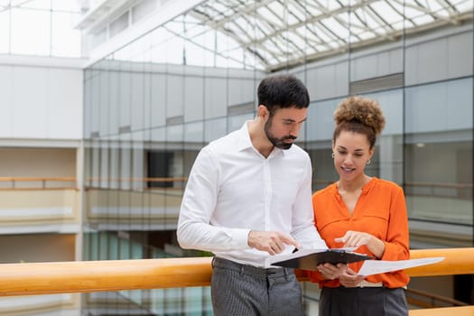 Businessman and lady in smart casual wear in the background business center. High quality photo