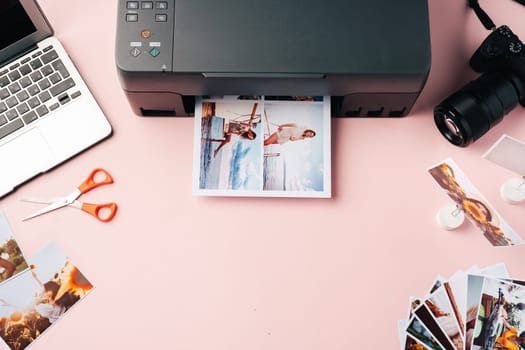 Printer, laptop and camera on the table close up. Printing photos