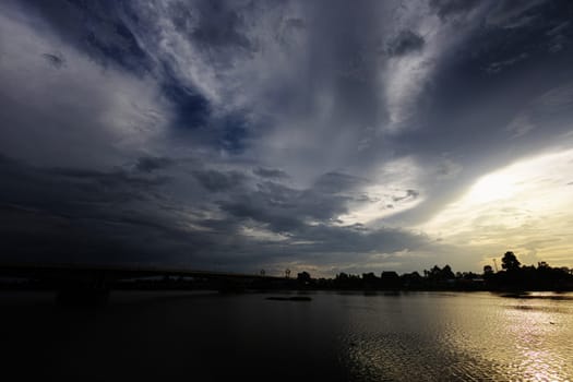 River Bridge Against Cloudy Sunset Sky. The Chaopraya River against the cloudy sky.