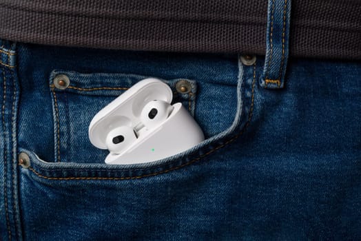 Antalya, Turkey - January 15, 2024: White wireless headphones Apple AirPods 3