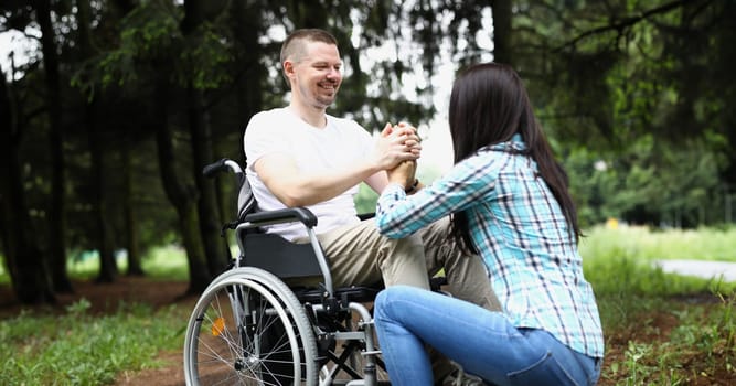 Portrait of wife and husband have meeting in nursing home, support in recovery. Disabled people problem, healthcare, family, support, help, nature concept