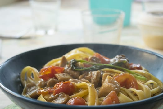 egg tagliatelle with porcini mushrooms and cherry tomatoes