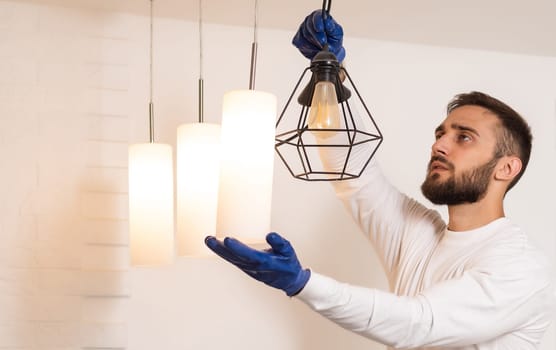 Man Fixing Light At Home