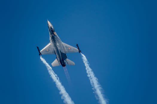 TORRE DEL MAR, MALAGA, SPAIN-JUL 28: Aircraft F-16 Belgian solo display taking part in a exhibition on the 2nd airshow of Torre del Mar on July 28, 2017, in Torre del Mar, Malaga, Spain