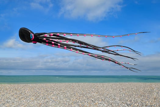 DIEPPE, FRANCE - SEPTEMBER 11, 2018: Kite festival. Octopus kites in the sky in the Atlantic ocean
