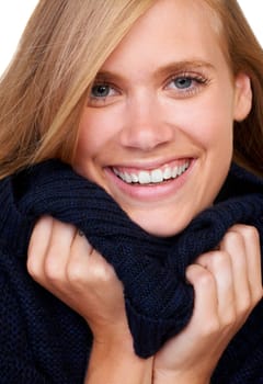 Winter, fashion and portrait of happy woman in studio with cool, trendy and comfortable outfit. Face, smile and female model with texture satisfaction from cosy, style or casual clothing choice.