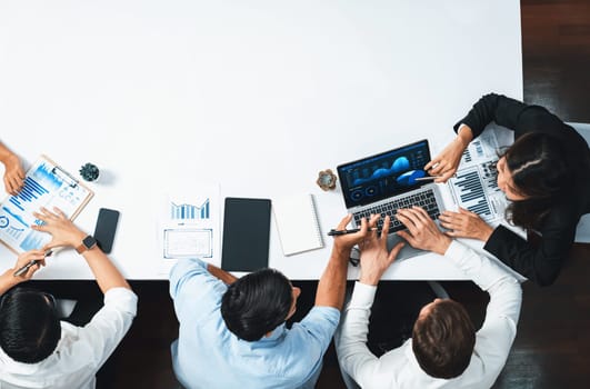 Group of office worker and businesspeople working on business financial data analysis. Empty space with editable blank background meeting table for customer design. Prudent