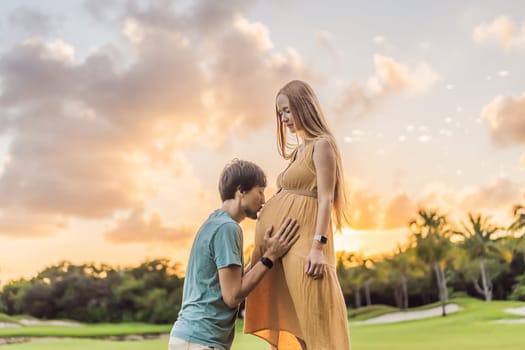 A blissful moment as a pregnant woman and her husband spend quality time together outdoors, savoring each other's company and enjoying the serenity of nature.