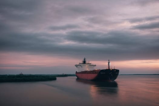 A photo of a large boat peacefully floating atop a body of water.