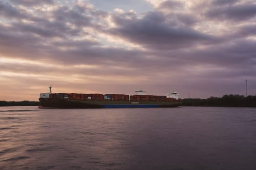 A massive cargo ship cruising through the water, exemplifying global transportation and the global economy.