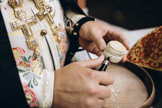 priest's hands and bread and prayer. High quality photo