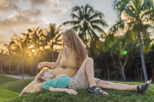 Heartwarming outdoor bonding as a pregnant mom and her son enjoy quality time together, savoring the beauty of nature and creating cherished moments.