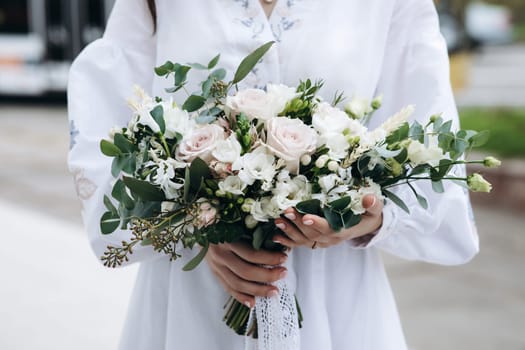 wedding flowers in the hands of the girl. High quality photo