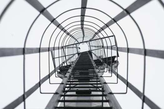 Stairs on a pole for climbing to the field for maintenance. Selective focus. High quality photo