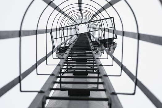 Stairs on a pole for climbing to the field for maintenance. Selective focus. High quality photo