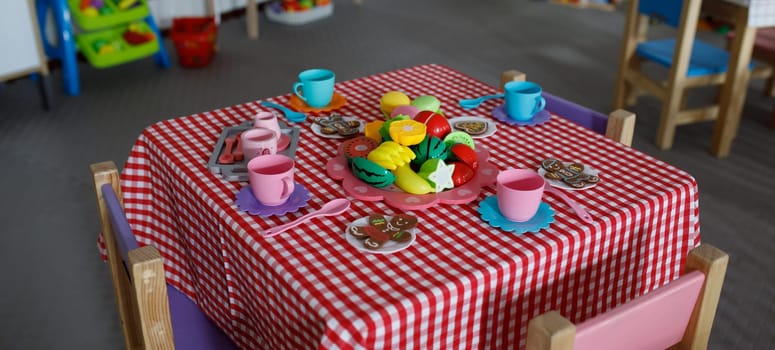 children's space and a table with toys for the kitchen. High quality photo