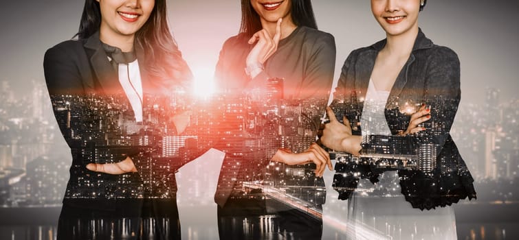 Double exposure image of many business people conference group meeting on city office building in background showing partnership success of business deal. Concept of teamwork, trust and agreement. uds