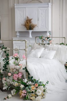 bright bed with flowers and decor. High quality photo