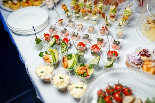 buffet table with toasts and snacks and desserts. High quality photo