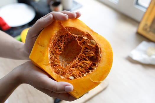 cut pumpkin many grains knife board hands. High quality photo