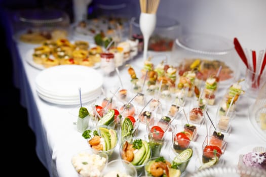 buffet table with toasts and snacks and desserts. High quality photo