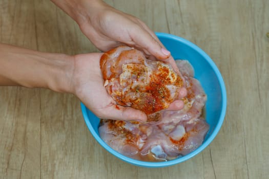 raw meat in hands with spices in a bowl. High quality photo