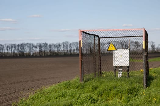 electrical hazard sign on the grid. High quality photo