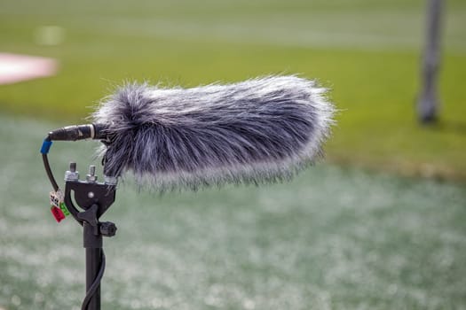 microphone recording voice at a football match. High quality photo