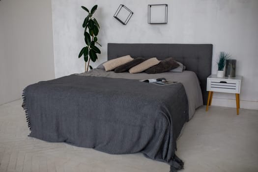bedroom, gray bed linen in the room. High quality photo