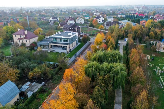 field autumn mountain forest trees houses. High quality photo