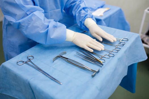sterile instruments for surgery on the tray and hands. High quality photo