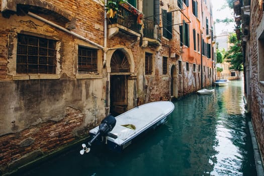 Venice narrow canal gondolas and boats. High quality photo