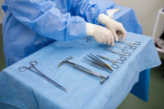 sterile instruments for surgery on the tray and hands. High quality photo