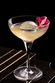 Luxury cocktail on the wooden table on a dark background