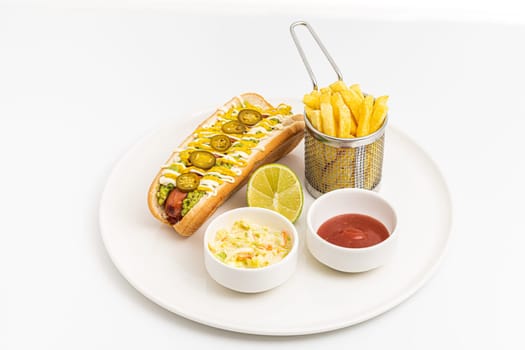 Delicious hot dog sandwich with sauces and fries on the side