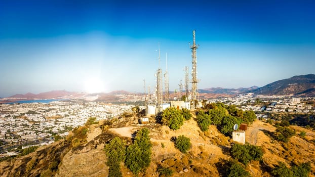Telecommunication tower on mountin with 4G 5G cellular network antenna on city background. telecommunications mast TV antennas wireless technology. download image