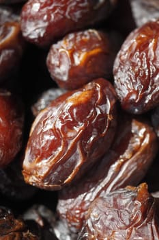 many date fruits display for sale at local market .