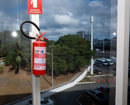 salvador, bahia, brazil - october 10, 2023: fire extinguisher seen in a commercial building in the city of Salvador