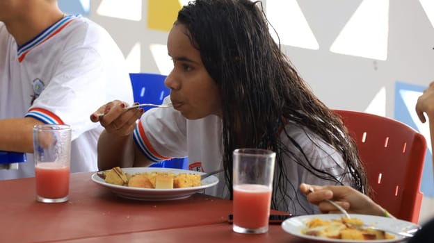 euclides da cunha, bahia, brazil - setembro 18, 2023: students from a public school having a meal at the teaching unit