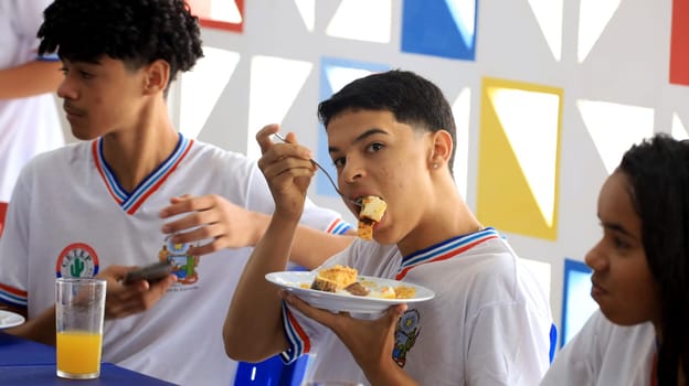 euclides da cunha, bahia, brazil - setembro 18, 2023: students from a public school having a meal at the teaching unit