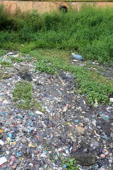 salvador, bahia, brazil - september 12, 2023: view of a river channel with lots of dirt and pollution in the city of Salvador.