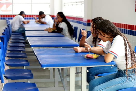 euclides da cunha, bahia, brazil - setembro 18, 2023: students from a public school having a meal at the teaching unit.