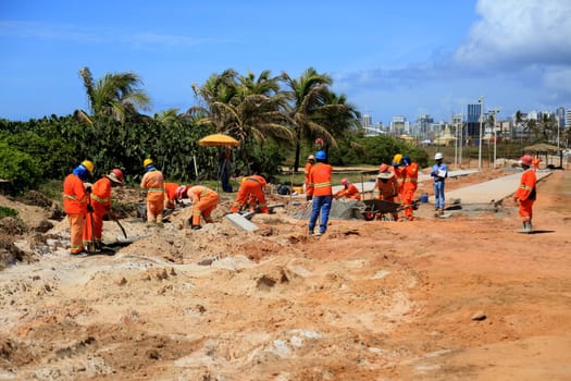 salvador, bahia, brazil - november 20, 2024: workers working on the Atlantic coast of the city of Salvador.