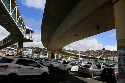 salvador, bahia, brazil - november 11, 2023: vehicle movement in traffic next to a viaduct in the city of Salvador.