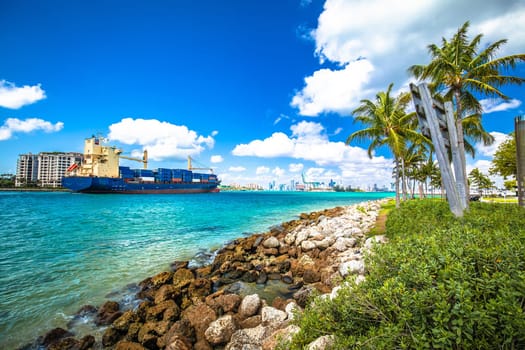 Container cargo ship entering the port of Miami through Government Cut channel, Florida state, USA