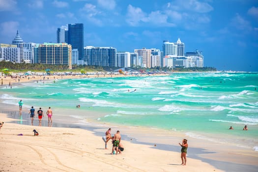 Miami Beach, Florida, USA, March 30 2022:  Miami Beach colorful beach and ocean view, Florida state, United States of America. People enjoying winter beach. 