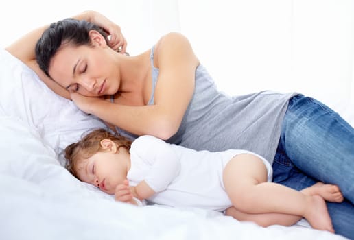 Mother, baby and sleeping on bed together for calm break, peace and dreaming to relax at home. Tired mom, young kid and asleep for newborn development, healthy childhood growth and cozy nap for rest.