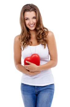 Woman, portrait and heart for love in studio, smiling and confidence with emoji on white background. Female person, happy and symbol for romance on valentines day, support and peace or kindness.