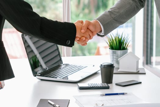 Businessman executive handshake with businesswoman worker in modern workplace office. People corporate business deals concept. uds