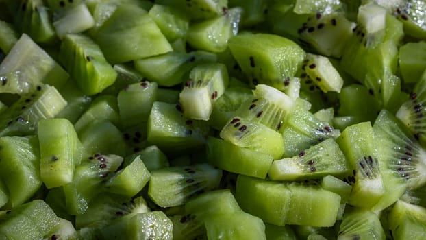 Ripe kiwi fruit. Detail of chopped exotic kiwi fruits used for desserts